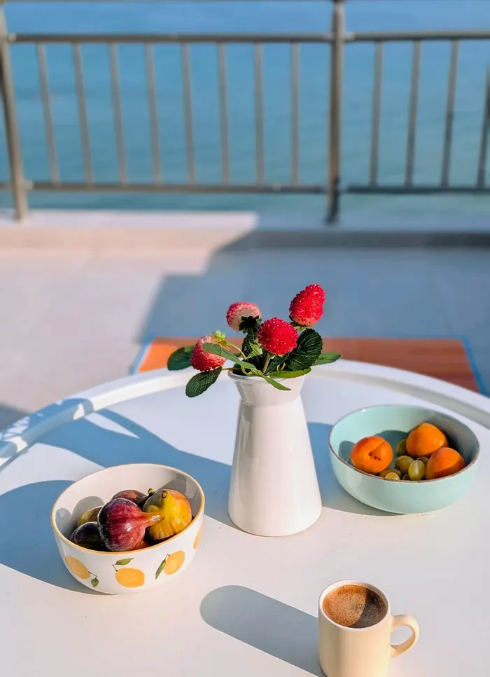 Flowers, fruit and coffee on the terrace