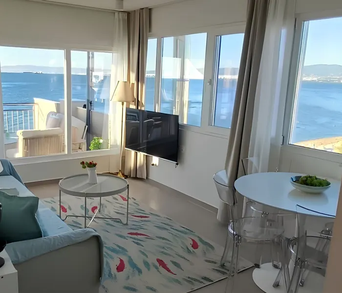 Dining corner by the windows with the sea outside