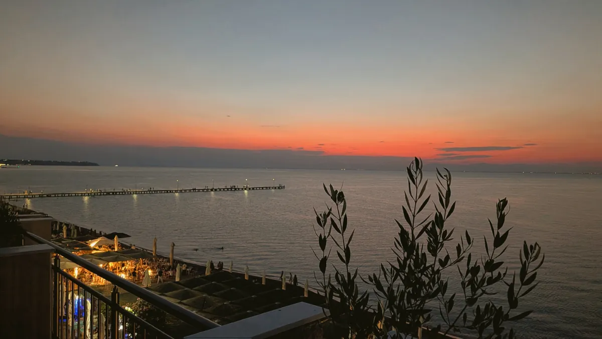 Perea’s waterfront and pier at dusk, seen from the terrace