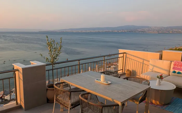 Terrace table at dusk overlooking the bay